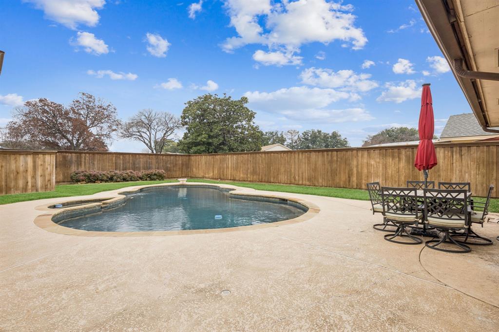 314 Amherst Avenue Richardson, TX 75081 - Photo 28 of 38 a view of a swimming pool with a lake