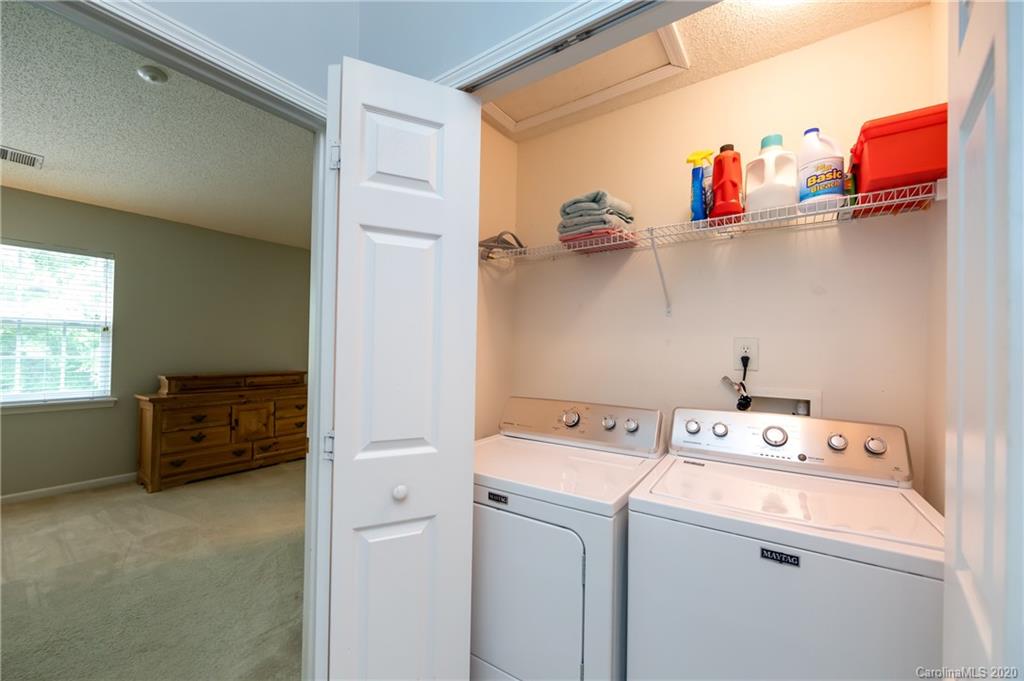 8312 Rudolph Road Charlotte, NC 28216 - Photo 22 of 37 a storage room with washer and dryer