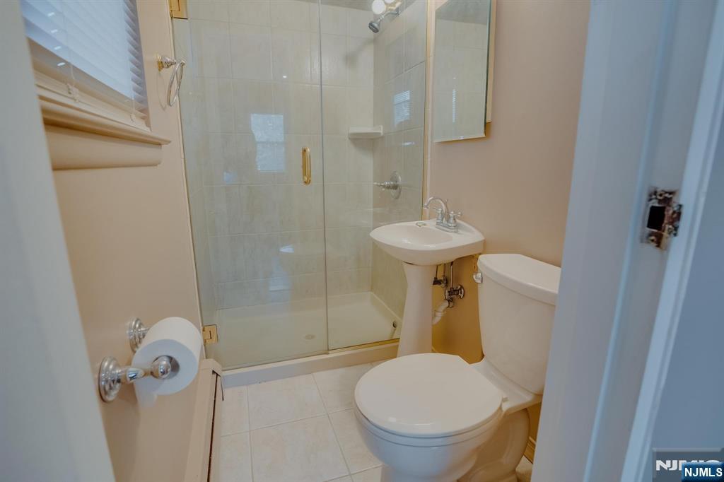 1138F Farm Road, Unit D Secaucus, NJ 07094 - Photo 4 of 8 a bathroom with a sink toilet and shower