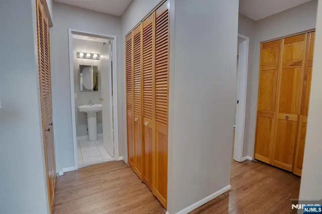 a view of a bathroom from a hallway