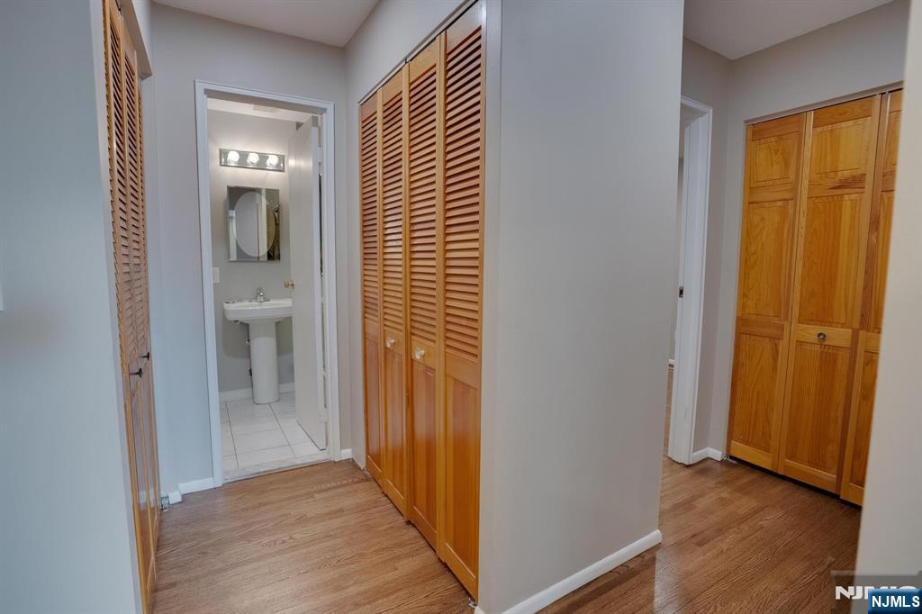 1138F Farm Road, Unit D Secaucus, NJ 07094 - Photo 6 of 8 a view of a bathroom from a hallway