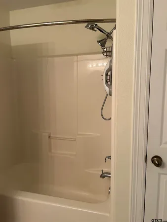an empty room with wooden floor