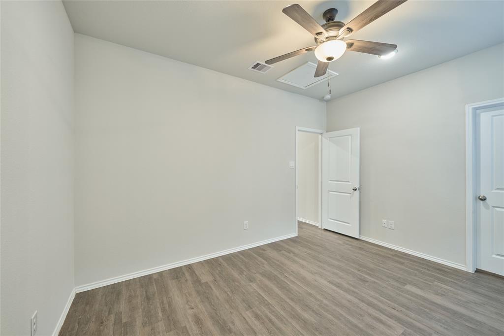 9992 Calendar Street Willis, TX 77318 - Photo 12 of 25 wooden floor in an empty room