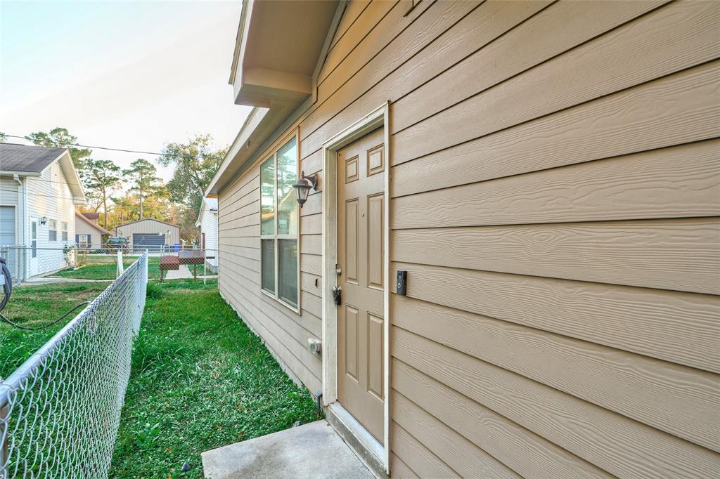9992 Calendar Street Willis, TX 77318 - Photo 21 of 25 a view of a back yard of the house