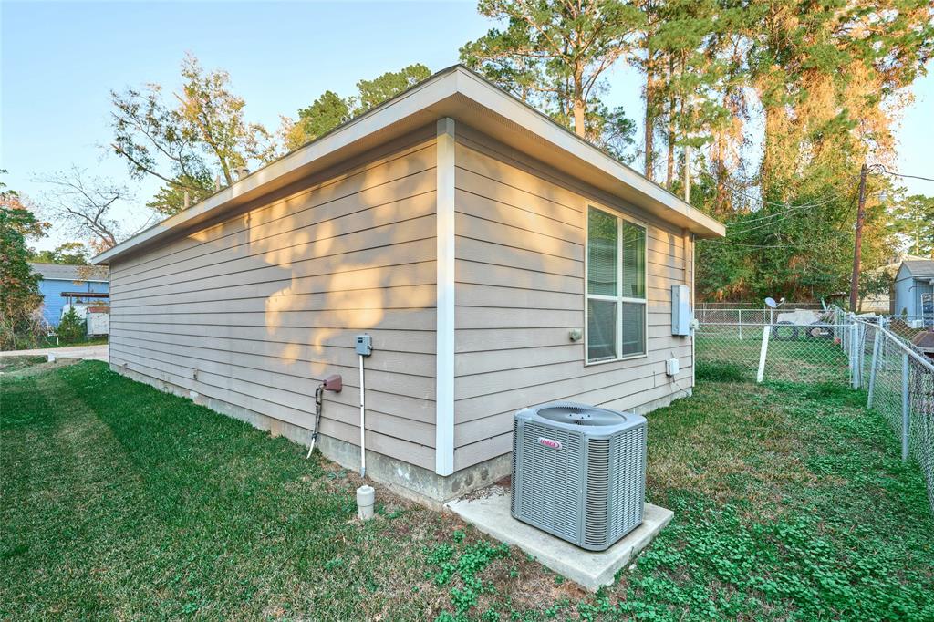 9992 Calendar Street Willis, TX 77318 - Photo 22 of 25 a view of a house with backyard
