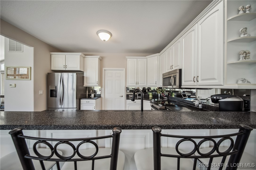 5889 Glaize Woods Road Osage Beach, MO 65065 - Photo 13 of 57