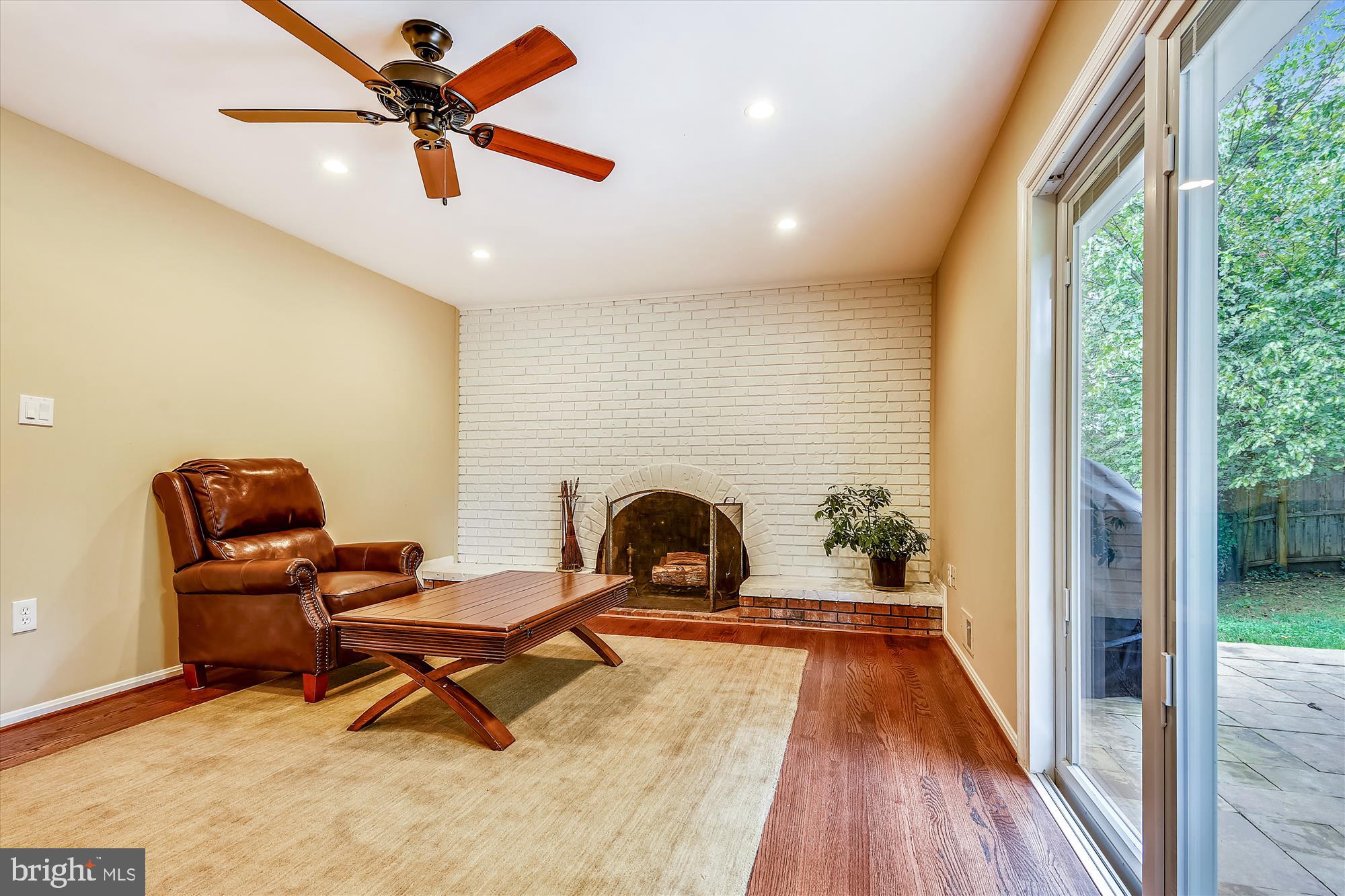 13621 Middlevale Lane Silver Spring, MD 20906 - Photo 11 of 25 a living room with furniture and a fireplace