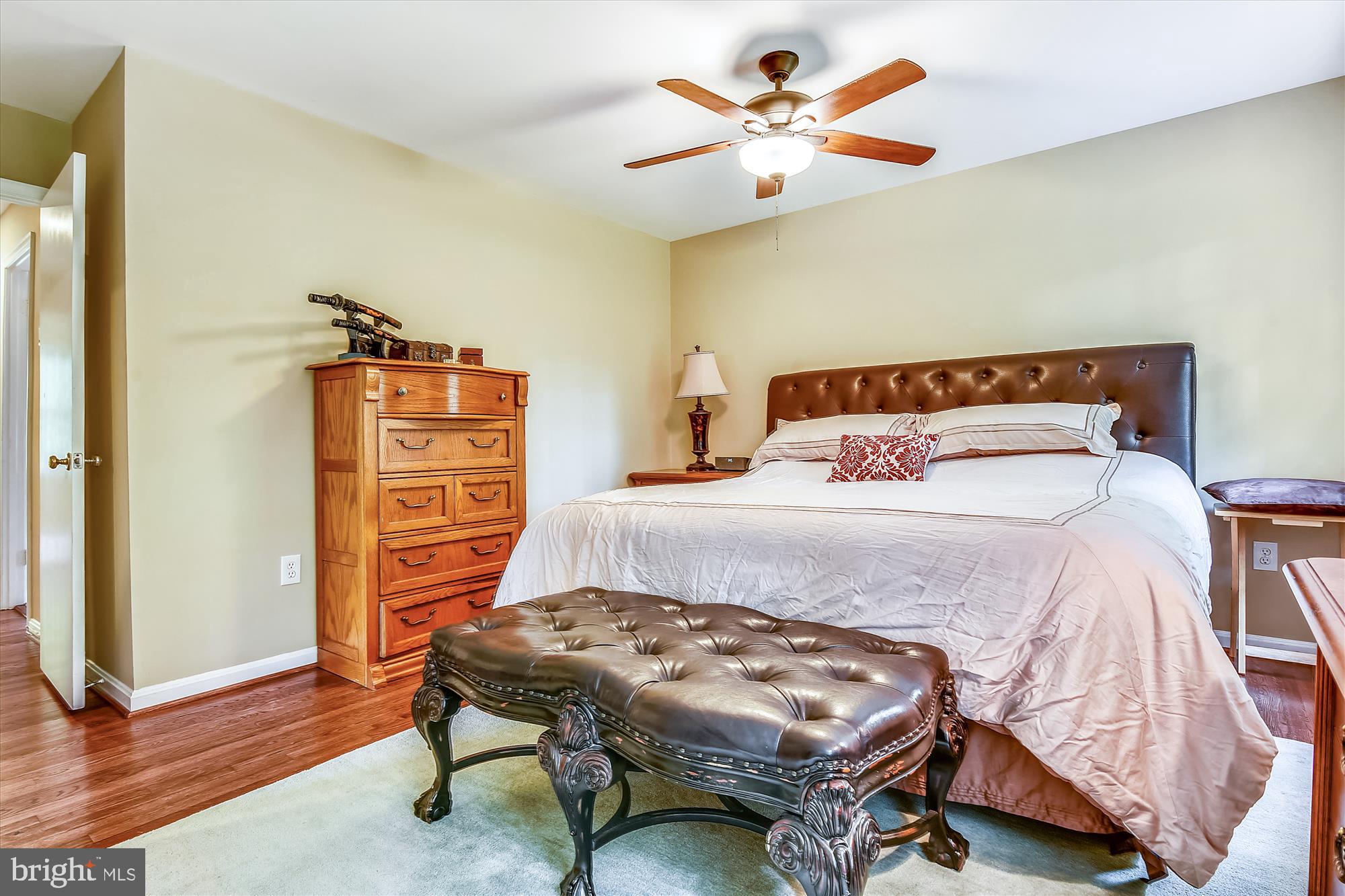 13621 Middlevale Lane Silver Spring, MD 20906 - Photo 14 of 25 a bedroom with a bed and a chandelier