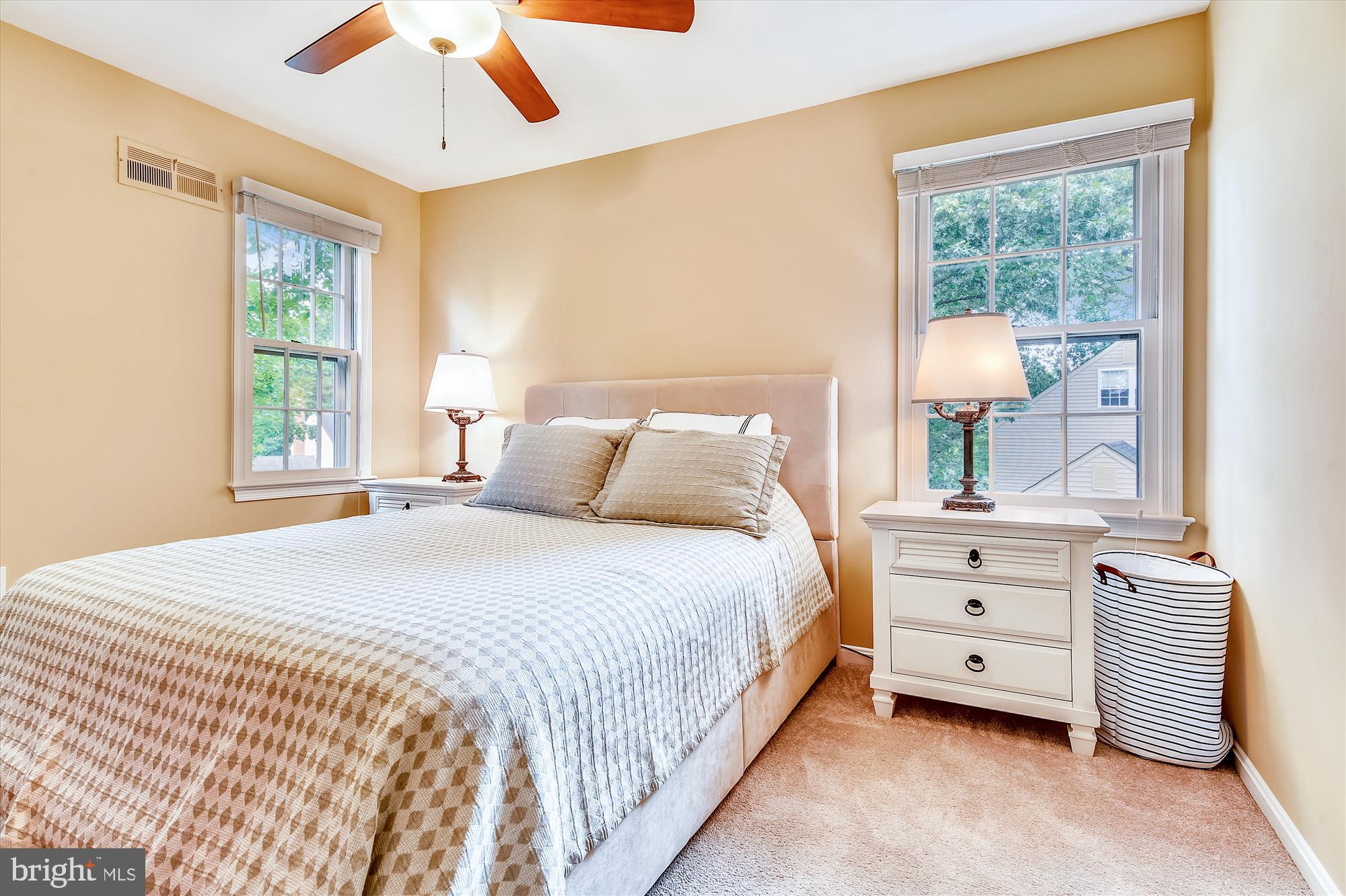13621 Middlevale Lane Silver Spring, MD 20906 - Photo 17 of 25 a bedroom with a bed and a window