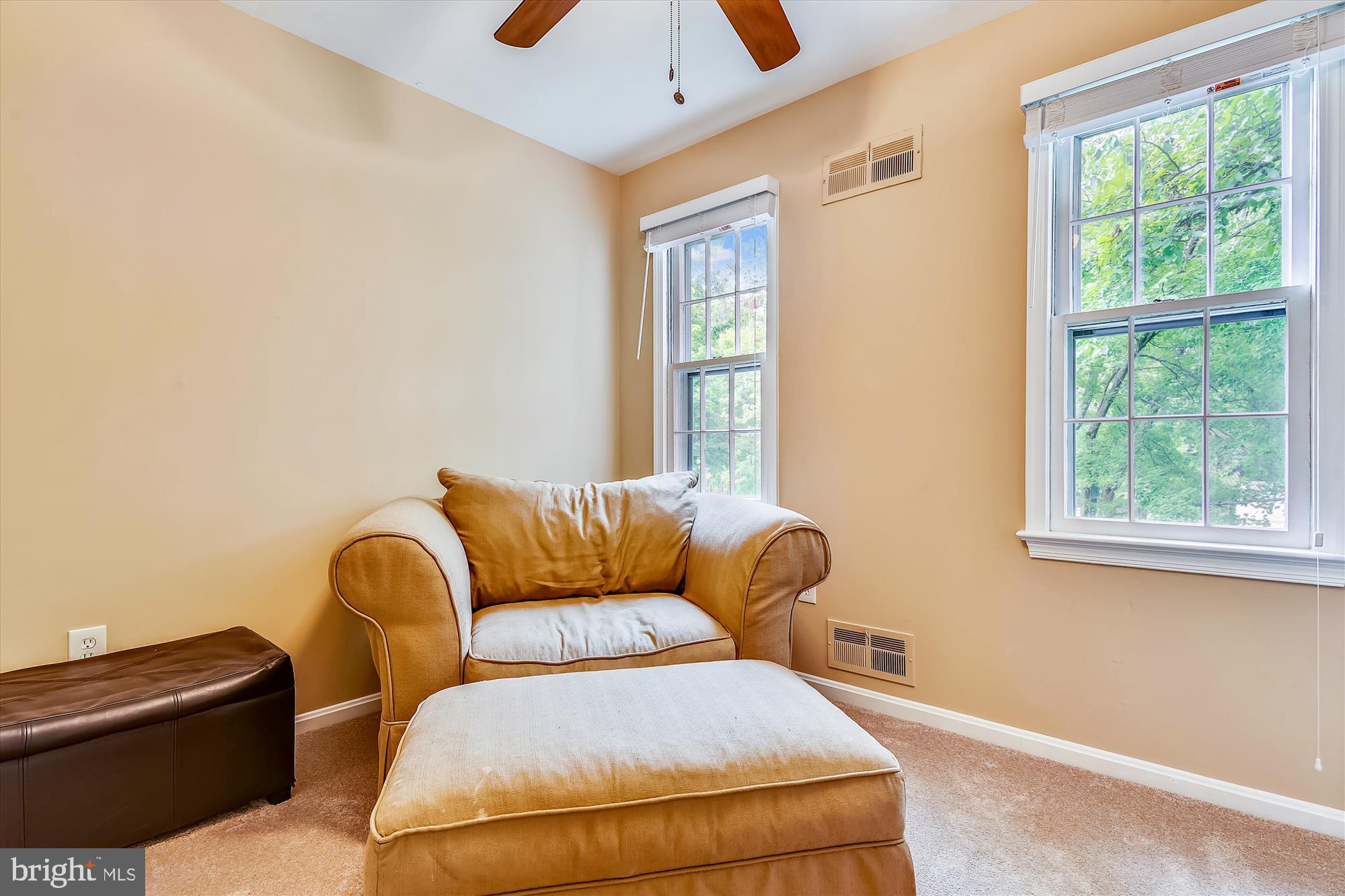 13621 Middlevale Lane Silver Spring, MD 20906 - Photo 19 of 25 a blue chair sitting in front of a window