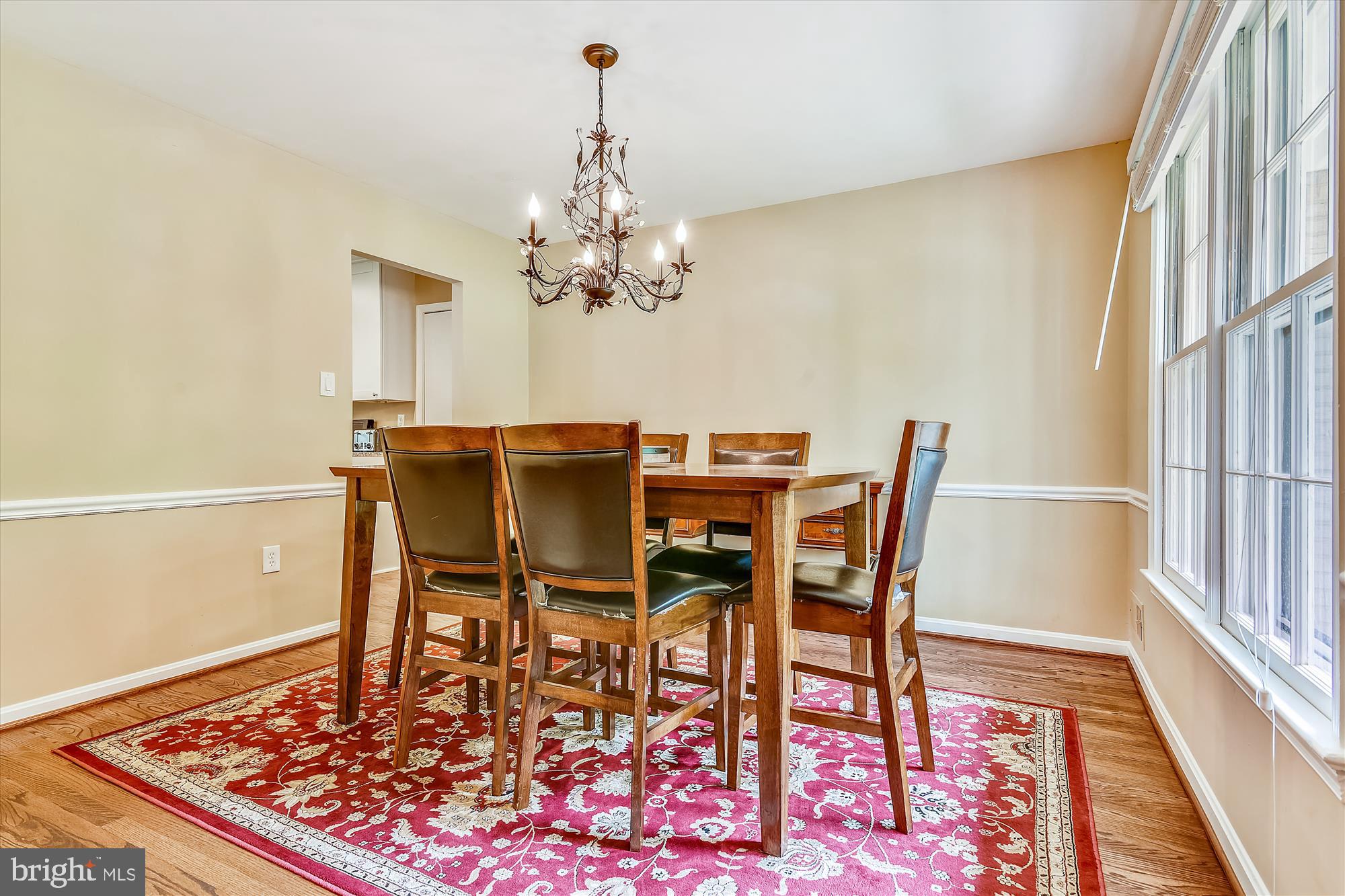 13621 Middlevale Lane Silver Spring, MD 20906 - Photo 5 of 25 a view of a dining room with furniture wooden floor and a rug