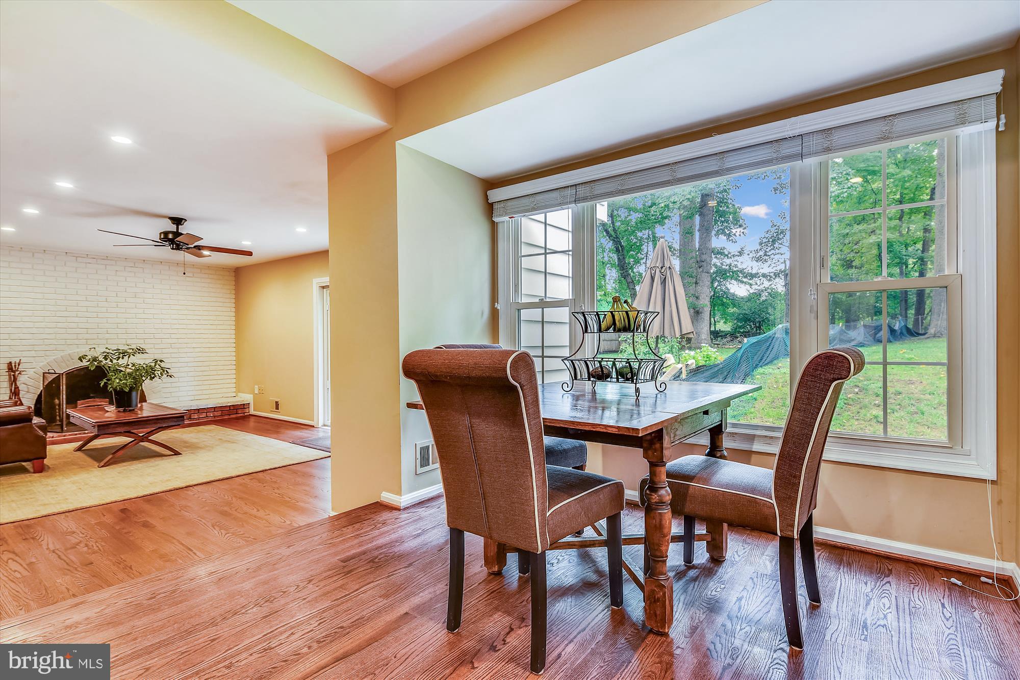 13621 Middlevale Lane Silver Spring, MD 20906 - Photo 9 of 25 a dining room with furniture window wooden floor