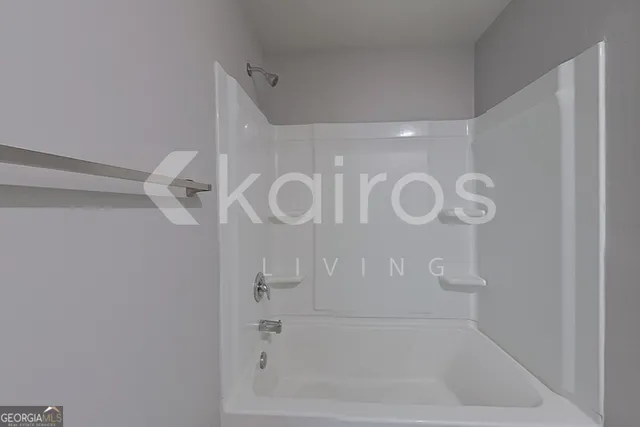 a bathroom with a glass shower door