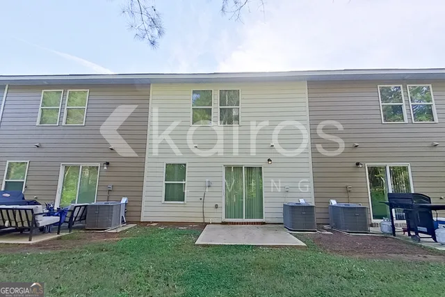 a front view of house with yard and outdoor seating