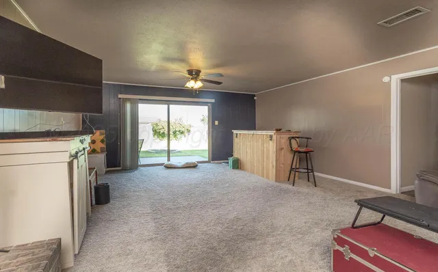 a view of a livingroom with storage & utility room