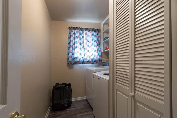 a bathroom with a window and a shower