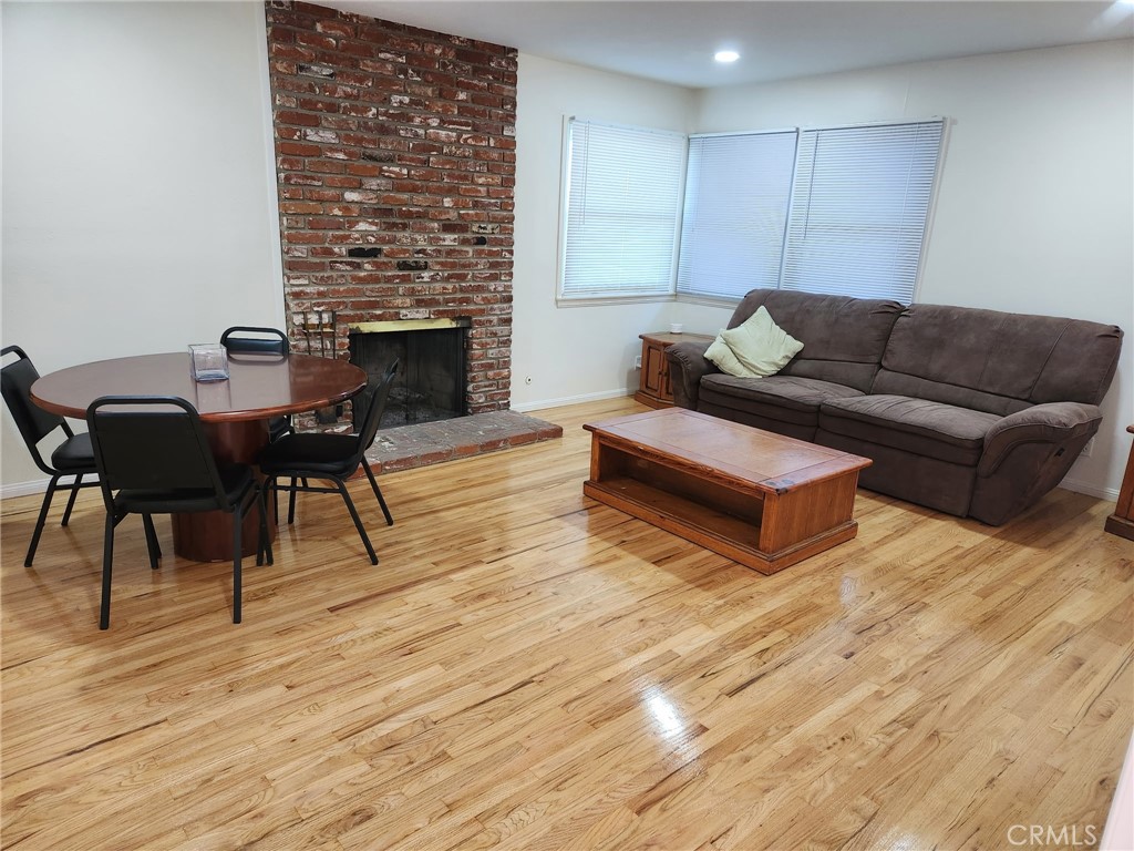 1011 East Chestnut Avenue Orange, CA 92867 - Photo 2 of 6 a living room with furniture and a fireplace