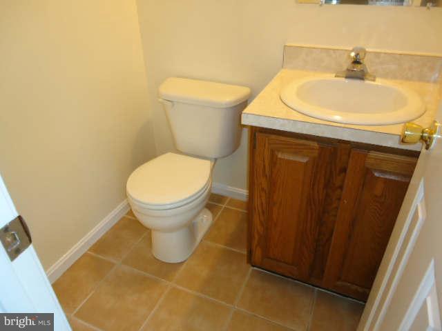 6838 Warfield Road Gaithersburg, MD 20882 - Photo 11 of 17 a bathroom with a sink and a toilet