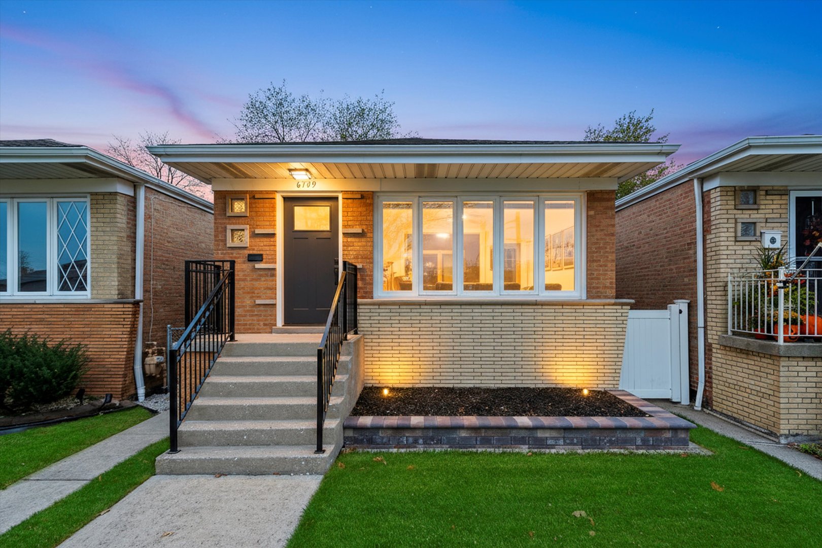 6709 West 59th Street Chicago, IL 60638 - Photo 1 of 1 a front view of a house with garden