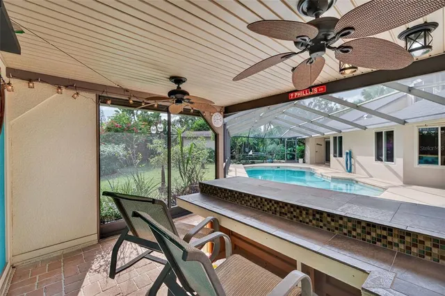 a view of a swimming pool with a patio