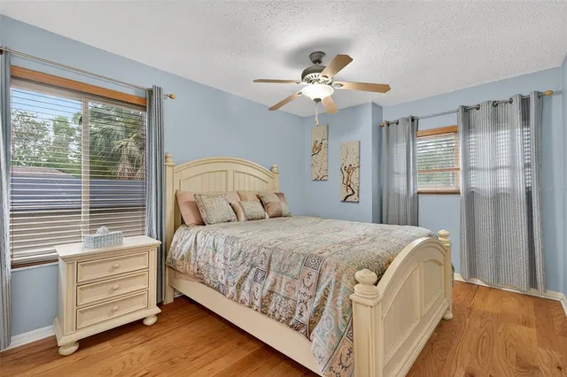 a bathroom with a granite countertop sink toilet a shower and a mirror