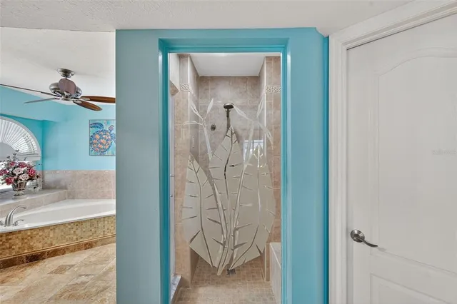 a view of room with window and wooden floor