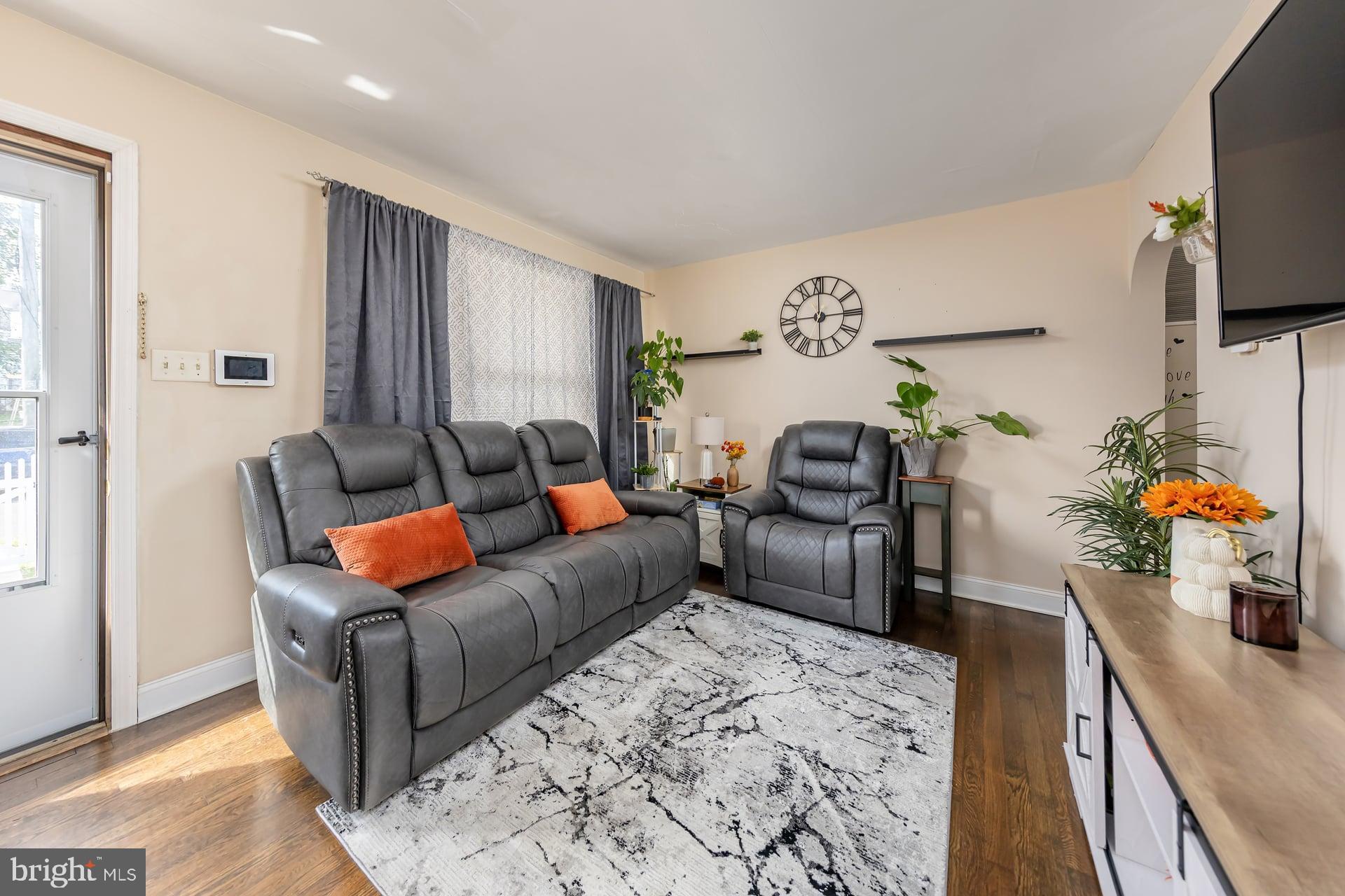 229 Filmore Street Riverside, NJ 08075 - Photo 3 of 18 a living room with furniture and a flat screen tv