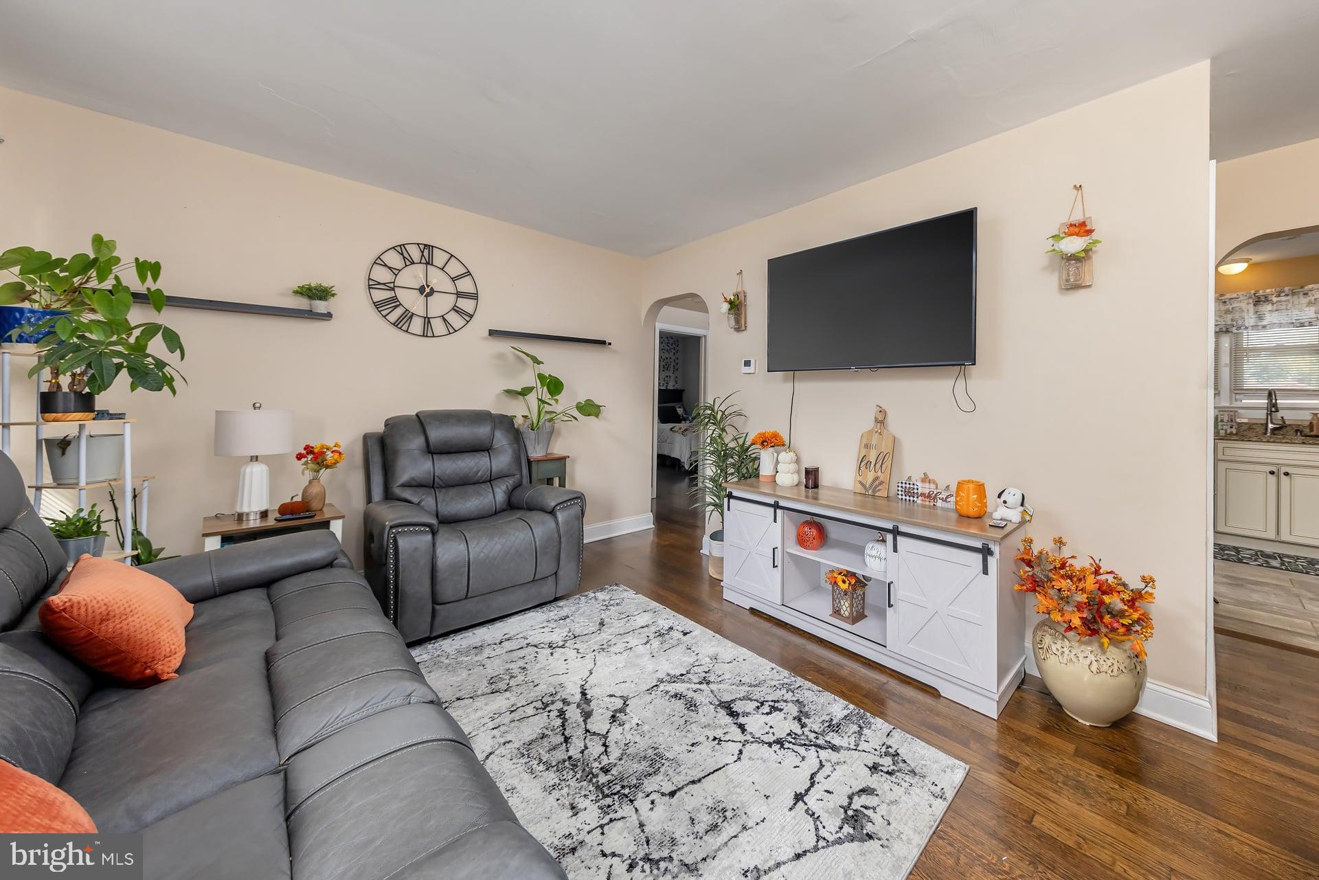 229 Filmore Street Riverside, NJ 08075 - Photo 4 of 18 a living room with furniture and a flat screen tv