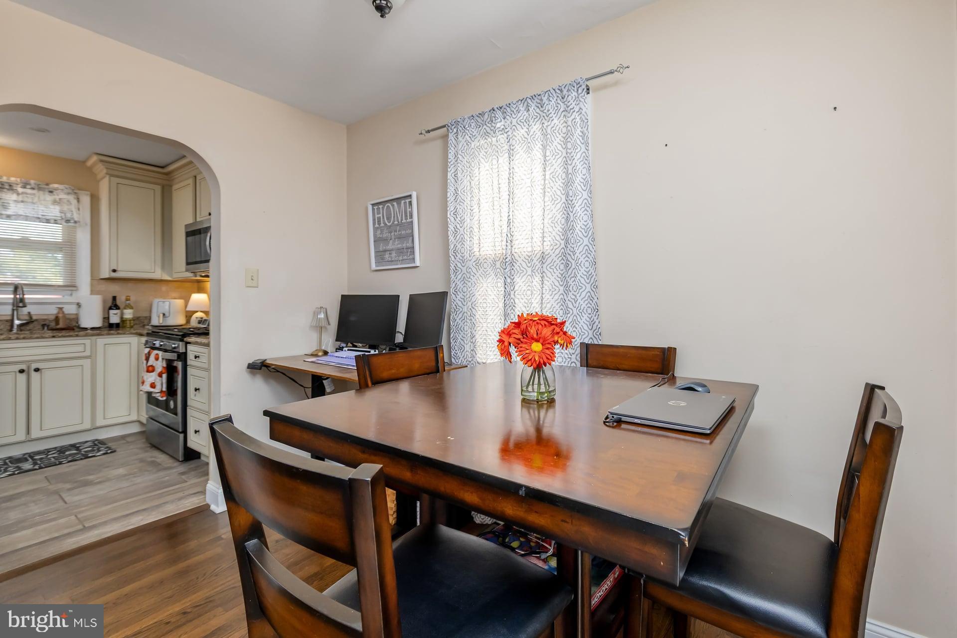 229 Filmore Street Riverside, NJ 08075 - Photo 5 of 18 a view of a dining room with furniture and wooden floor
