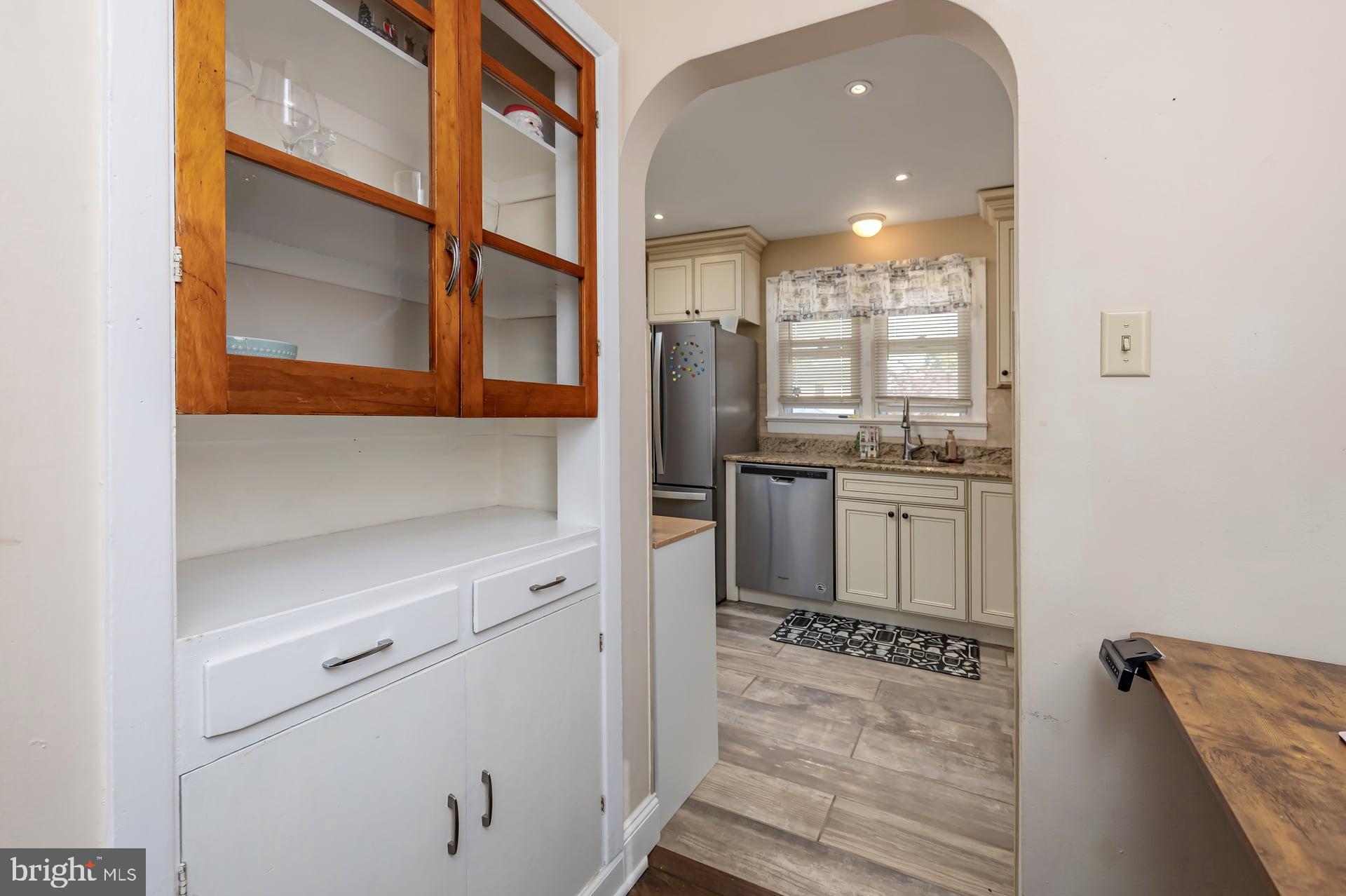 229 Filmore Street Riverside, NJ 08075 - Photo 6 of 18 a kitchen with stainless steel appliances granite countertop a stove a sink and a refrigerator