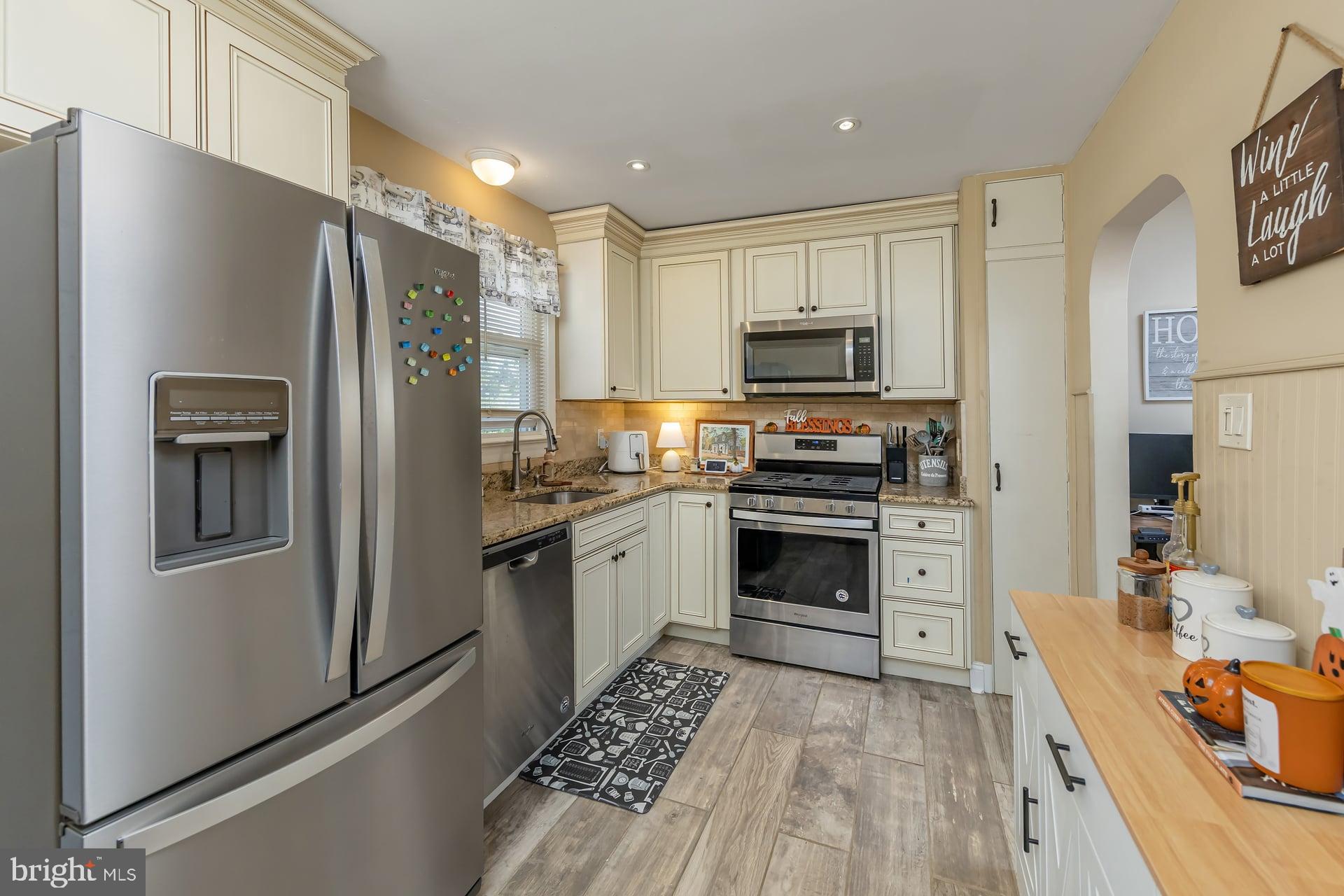 229 Filmore Street Riverside, NJ 08075 - Photo 8 of 18 a kitchen with stainless steel appliances a refrigerator stove and sink