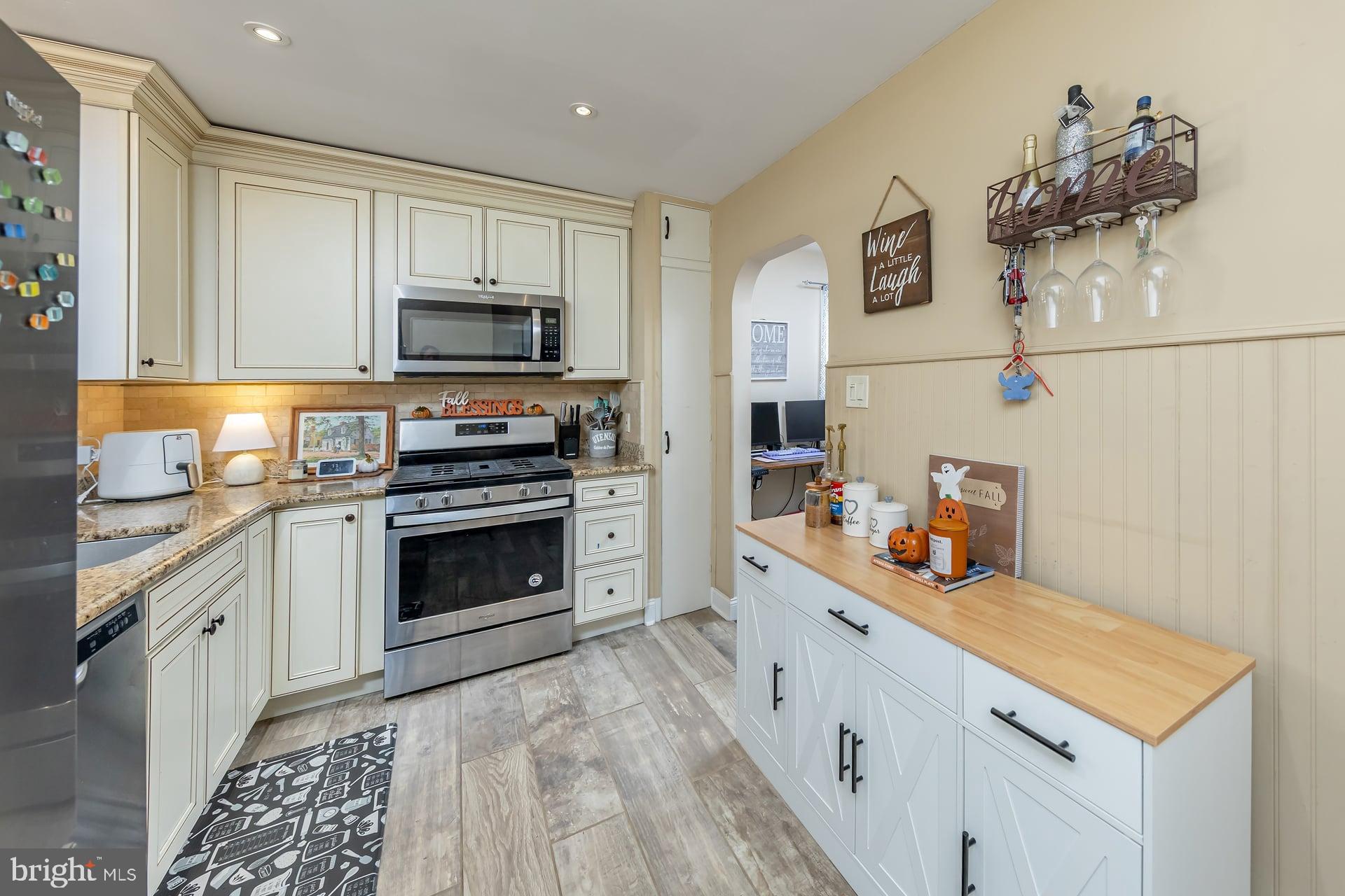 229 Filmore Street Riverside, NJ 08075 - Photo 9 of 18 a kitchen with granite countertop a sink and steel appliances