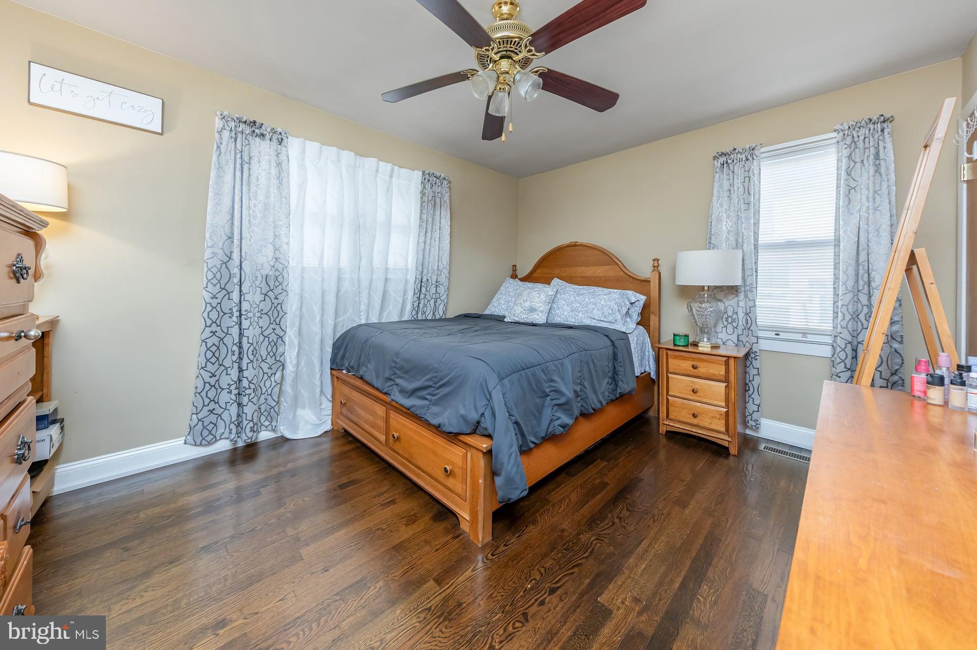 229 Filmore Street Riverside, NJ 08075 - Photo 10 of 18 a bed room with a bed and a chandelier