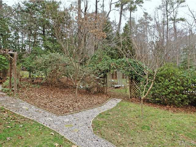 1605 Chatsworth Lane Raleigh, NC 27614 - Photo 20 of 25 Lovely landscaped back yard with trellises, benches and water fixtures! Back Yard