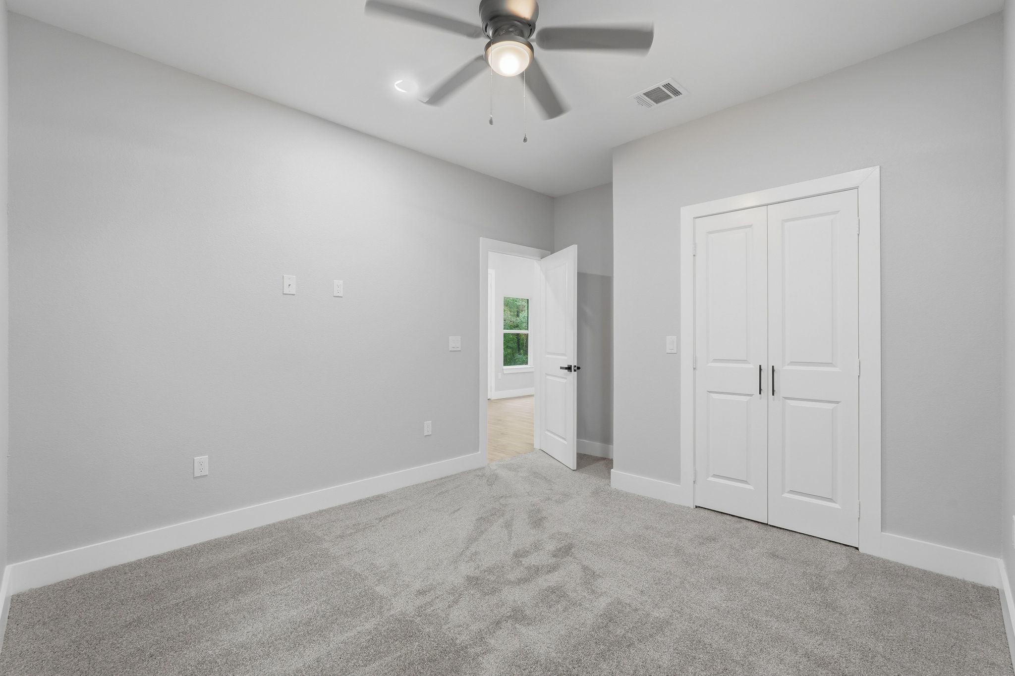 3575 Roy Bean Road Willis, TX 77378 - Photo 28 of 40 an empty room with chandelier fan