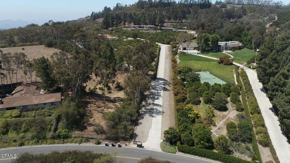 aerial view of a house with a yard