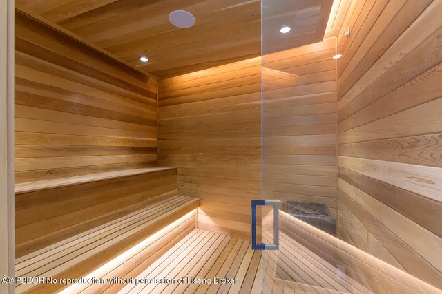 a bathroom with a bathtub and shower