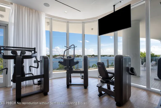 a view of a livingroom with furniture and a flat screen tv