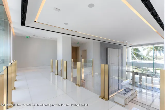 a view of a hallway with wooden floor and glass door