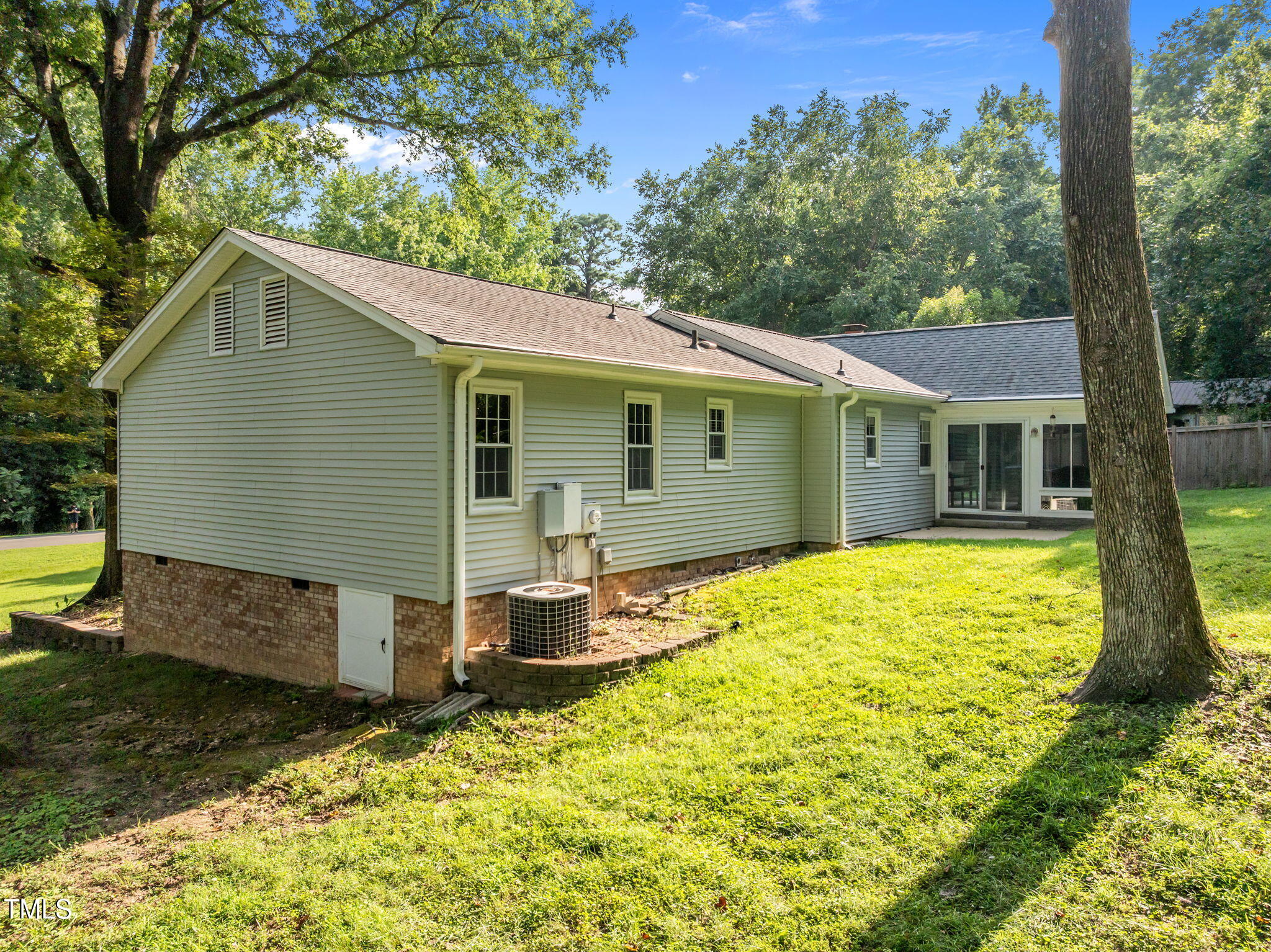 219 Barclay Road Durham, NC 27712 - Photo 27 of 36 a backyard of a house with yard and outdoor seating