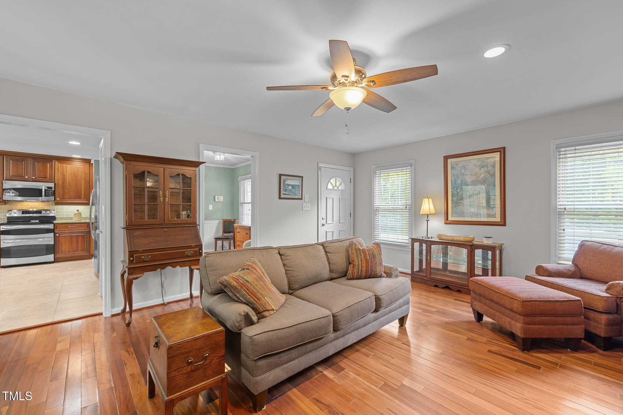 219 Barclay Road Durham, NC 27712 - Photo 5 of 36 a living room with furniture and a wooden floor