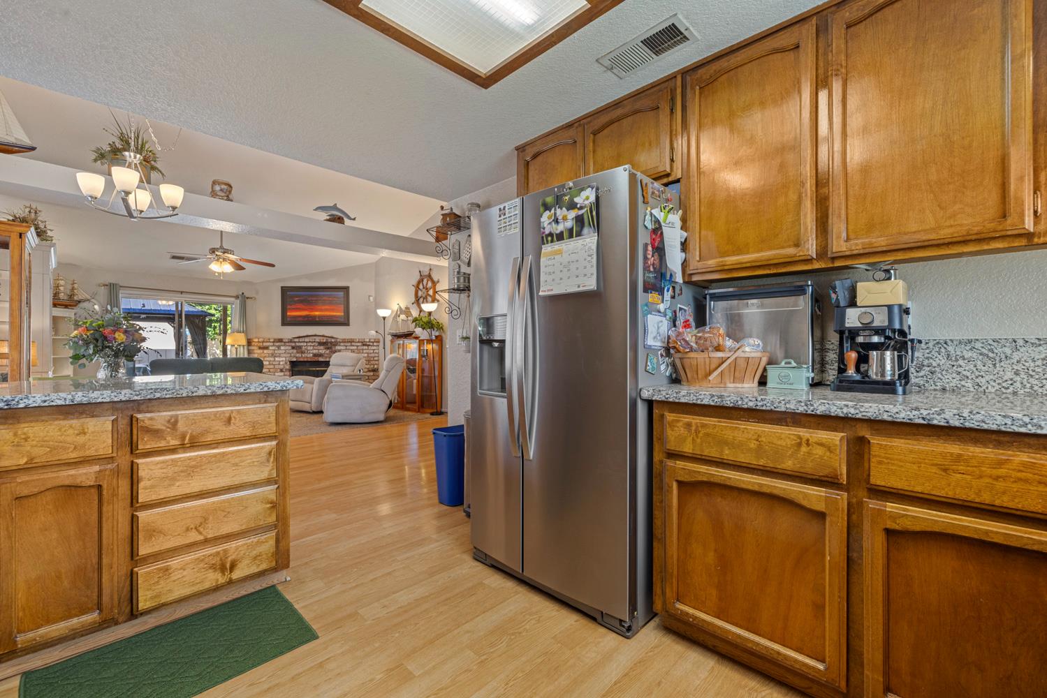 1121 Raymond Drive Modesto, CA 95351 - Photo 14 of 44 a kitchen with stainless steel appliances granite countertop a refrigerator and cabinets