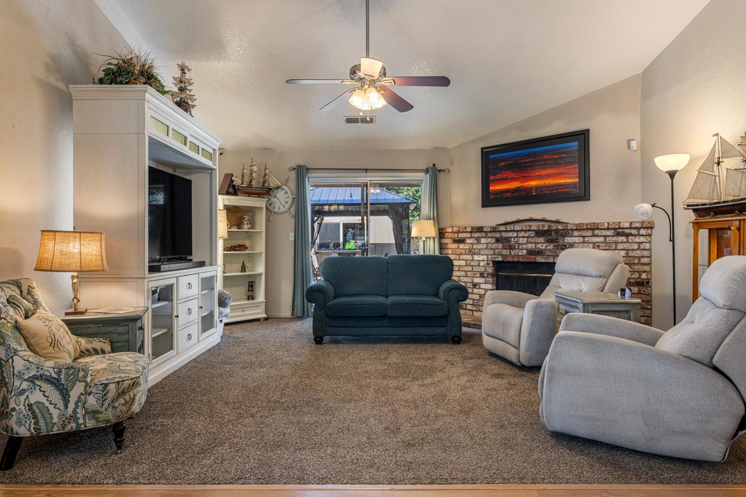 1121 Raymond Drive Modesto, CA 95351 - Photo 15 of 44 a living room with furniture and a flat screen tv