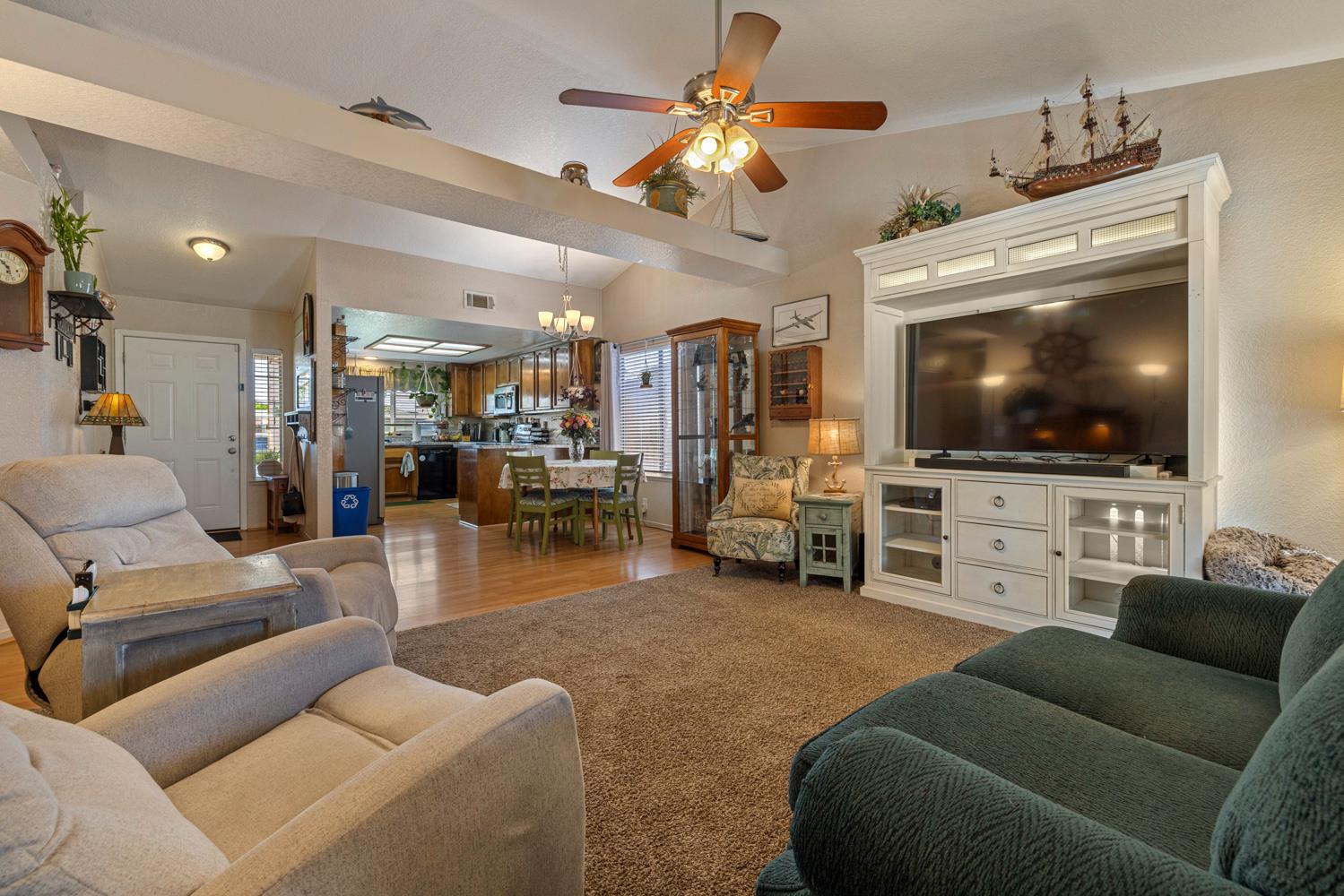 1121 Raymond Drive Modesto, CA 95351 - Photo 17 of 44 a living room with furniture and a flat screen tv