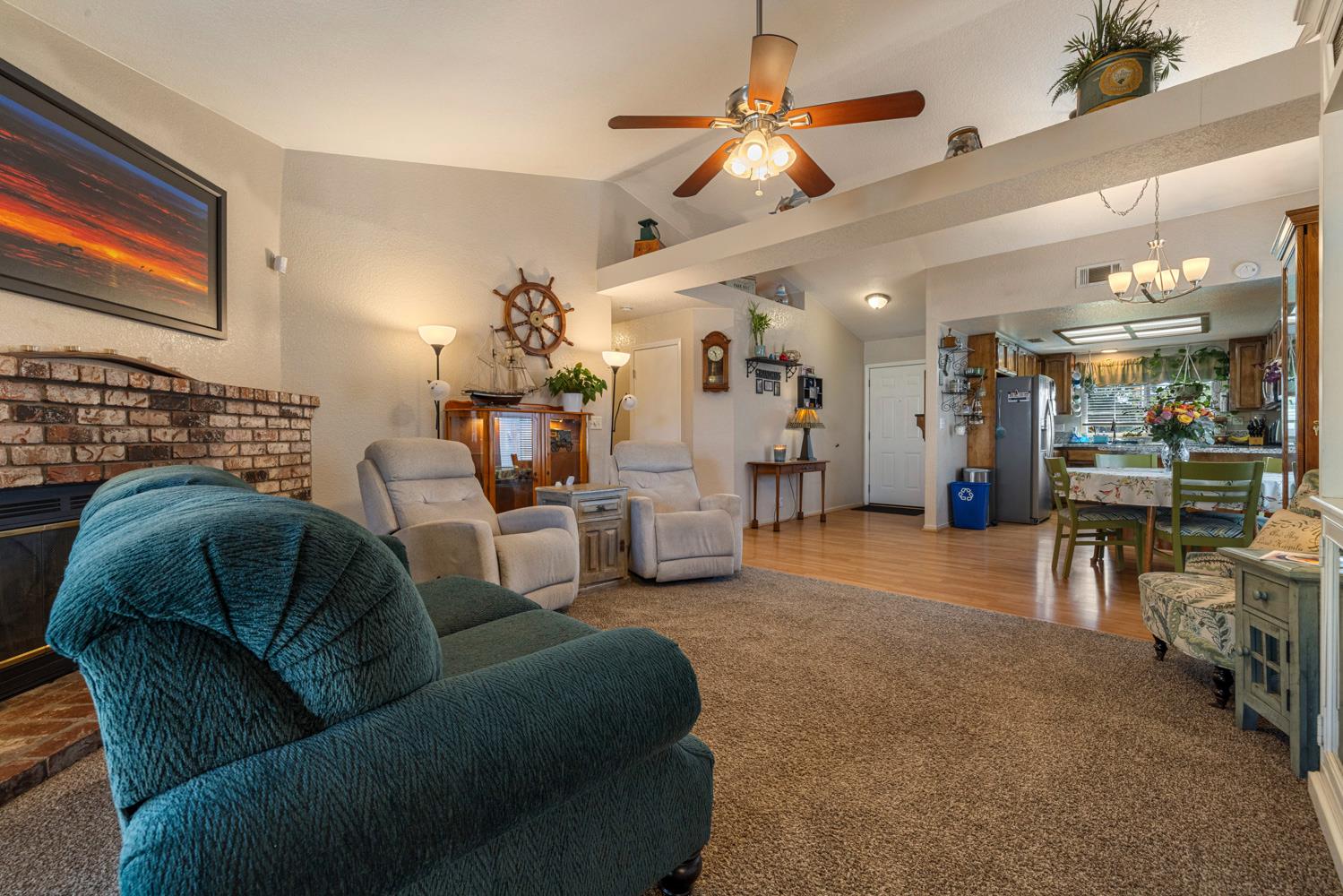 1121 Raymond Drive Modesto, CA 95351 - Photo 18 of 44 a living room with furniture and a chandelier