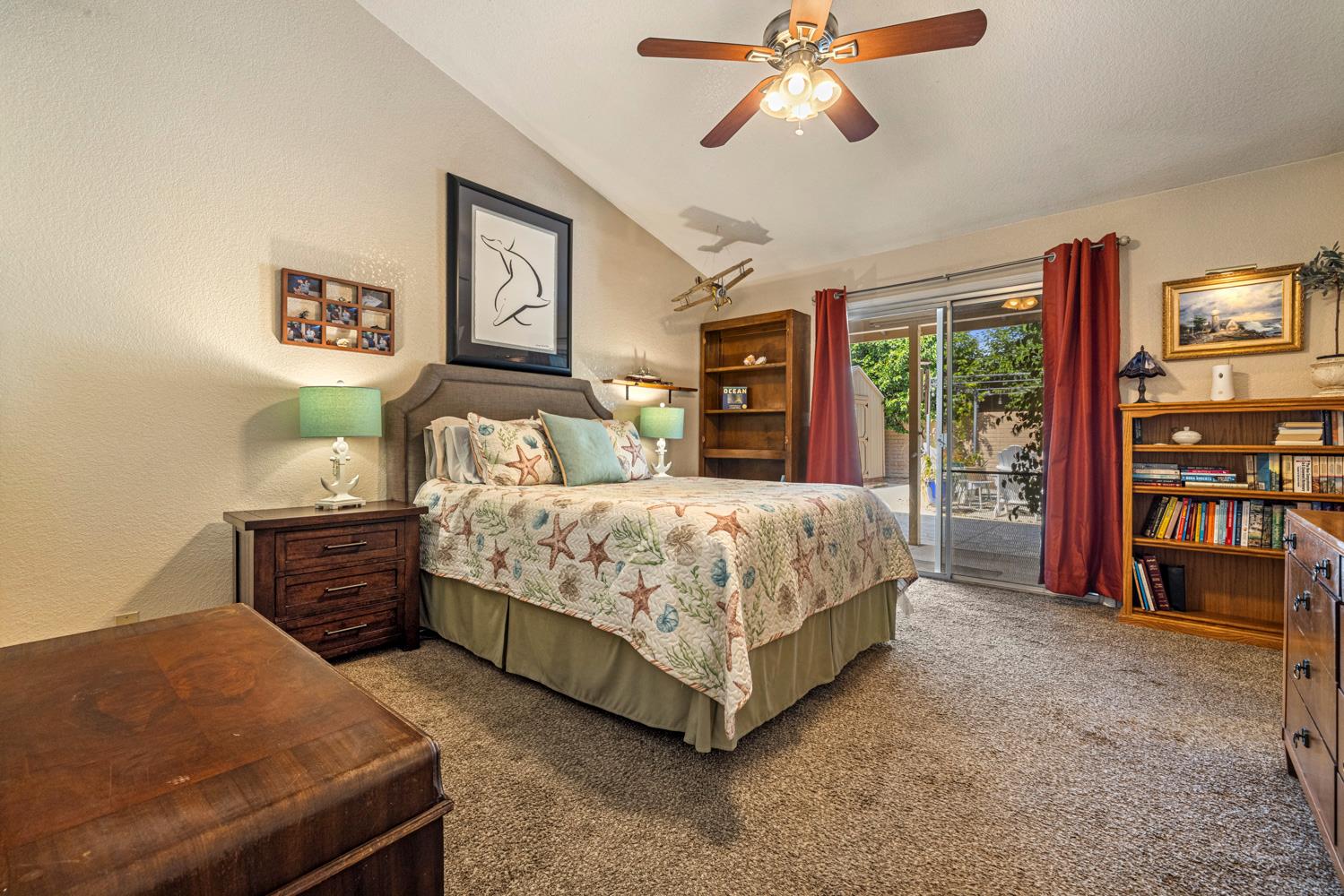 1121 Raymond Drive Modesto, CA 95351 - Photo 20 of 44 a bedroom with a bed and a chandelier