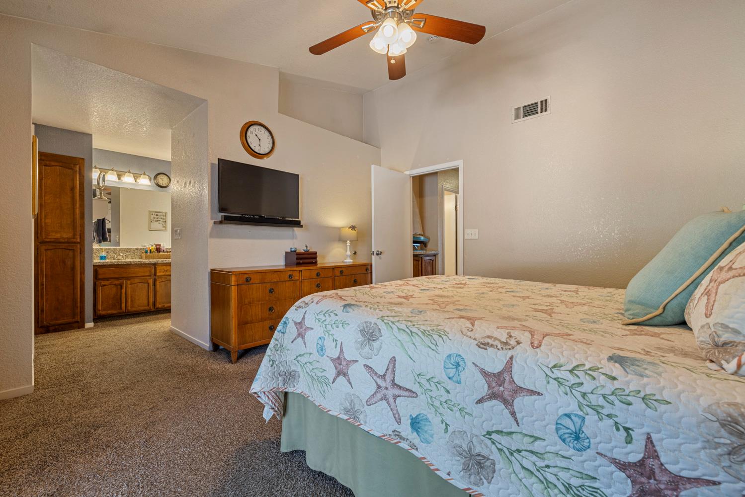 1121 Raymond Drive Modesto, CA 95351 - Photo 21 of 44 a bedroom with a bed and a flat screen tv