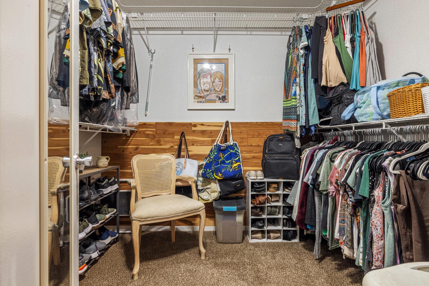 1121 Raymond Drive Modesto, CA 95351 - Photo 25 of 44 a view of walk in closet with clothes and shoes