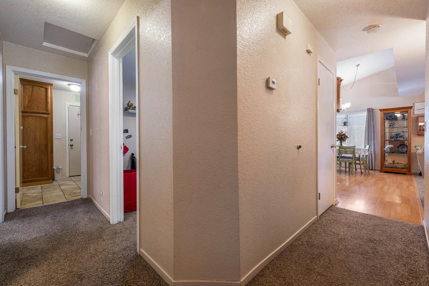 1121 Raymond Drive Modesto, CA 95351 - Photo 26 of 44 a view of a hallway with dining area