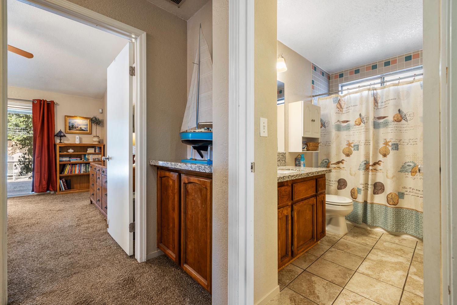 1121 Raymond Drive Modesto, CA 95351 - Photo 27 of 44 a view of kitchen with refrigerator and cabinets